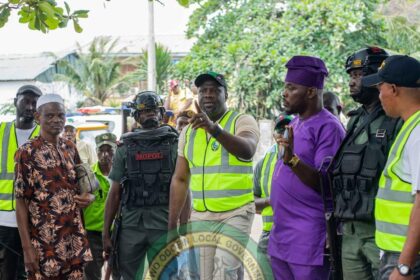 R-L: Hon. Egobi Osagie Daniel, Executive Chairman AOLG Prince Lanre Sanusi addressing residents during the clearance of the shanties.