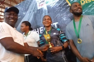 The female single champions, Queen Chibuzor receiving her trophy